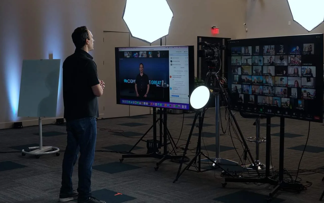 Broadcast cameras, softboxes, and monitors set for a live stream